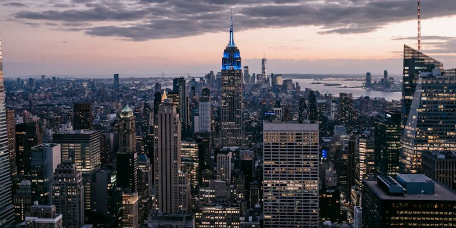 Cityscape with multistory house exteriors under cloudy sky