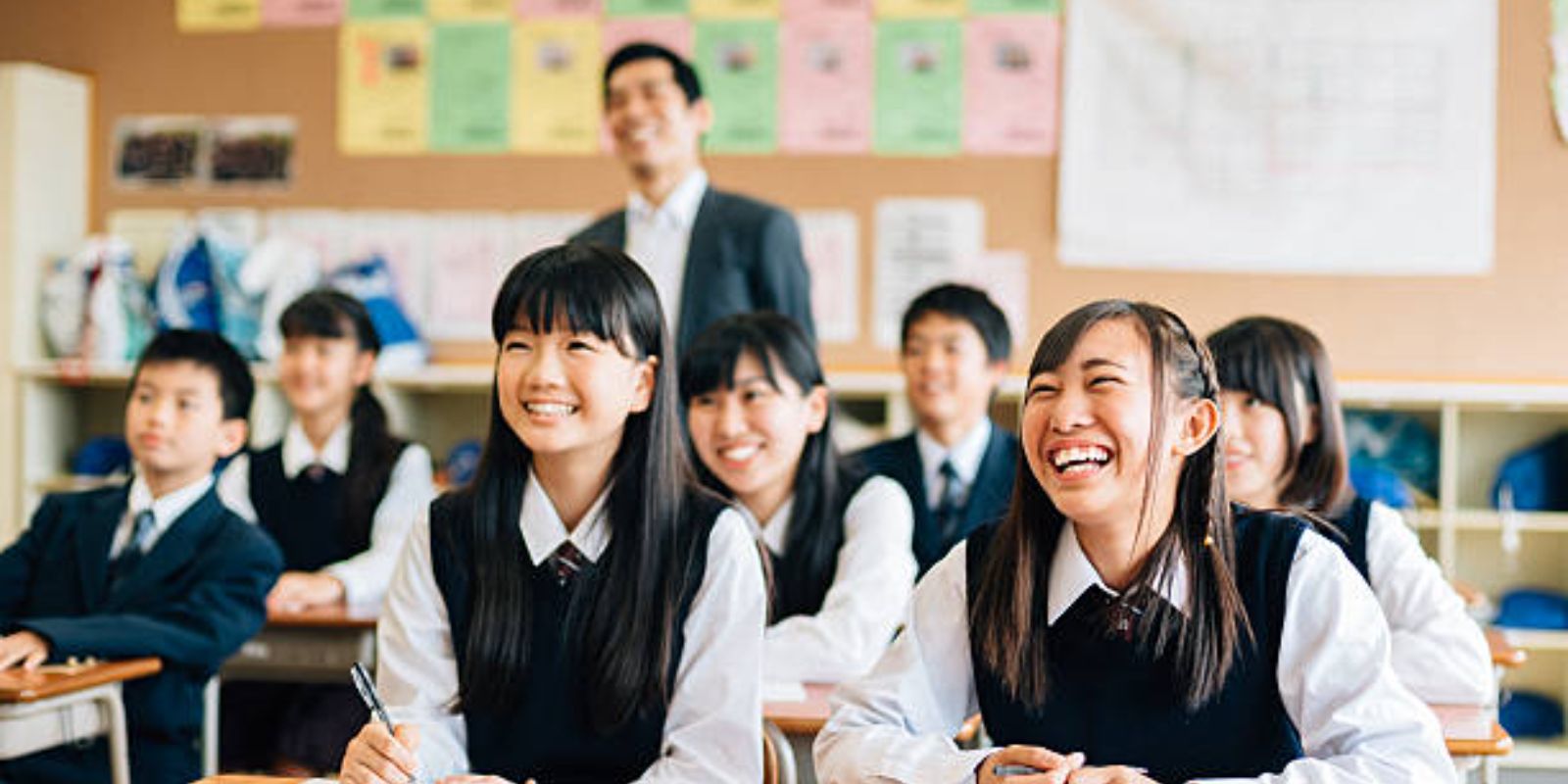 High School students laughing at a funny presentation or performance in class