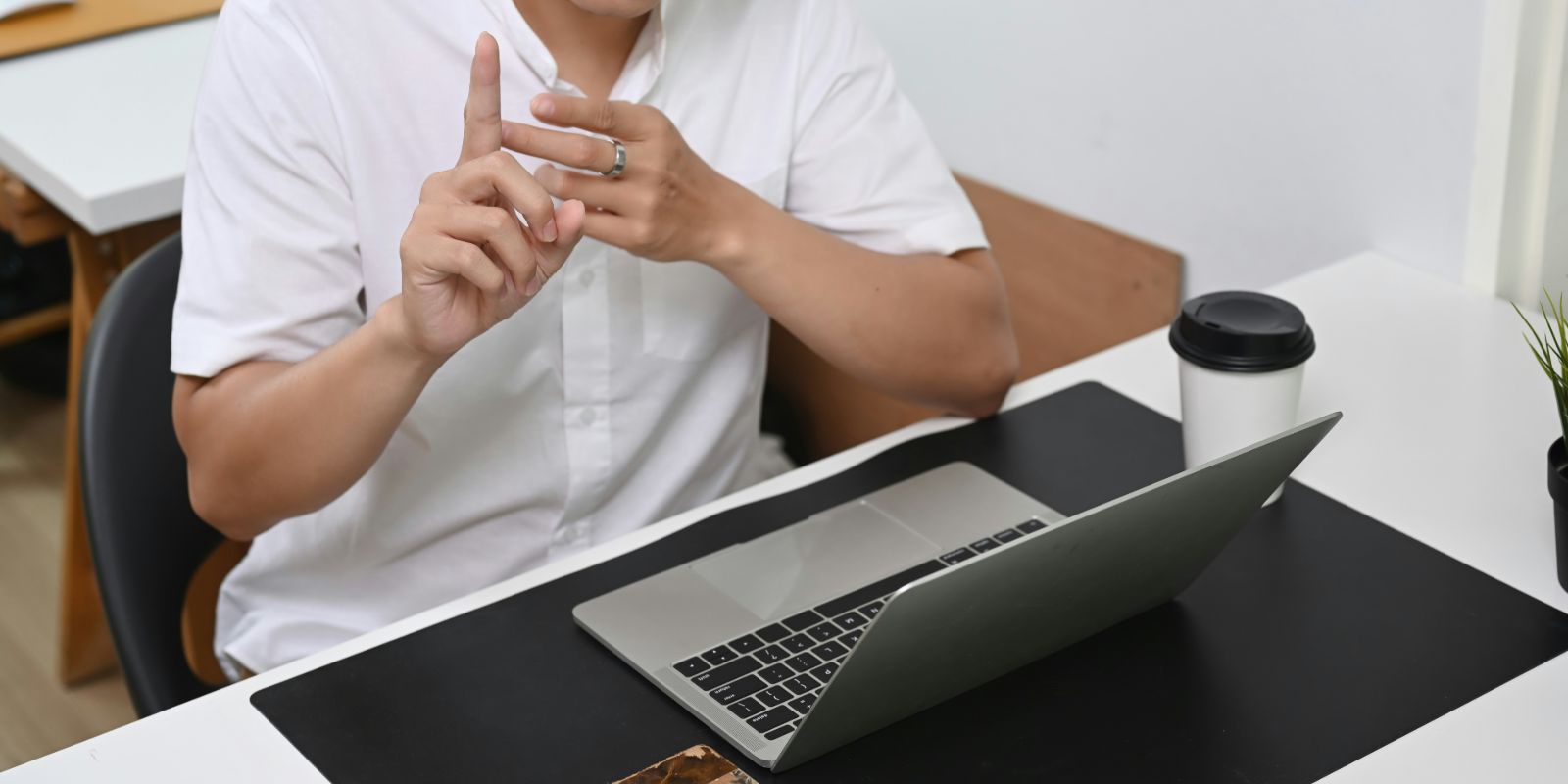 Person teaching English online from a laptop