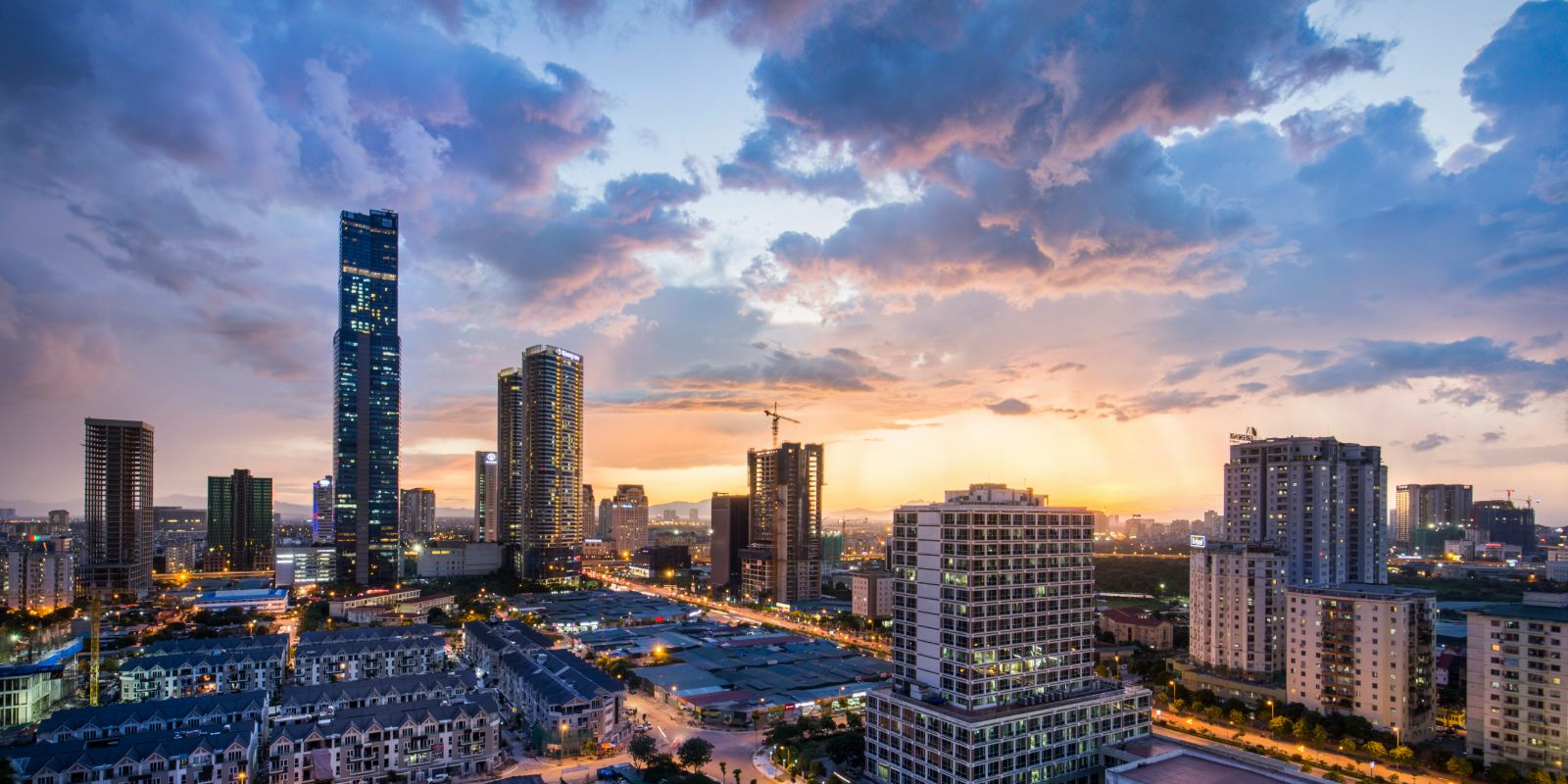 Skyline of Hanoi, Vietnam at sunset, with tall modern buildings